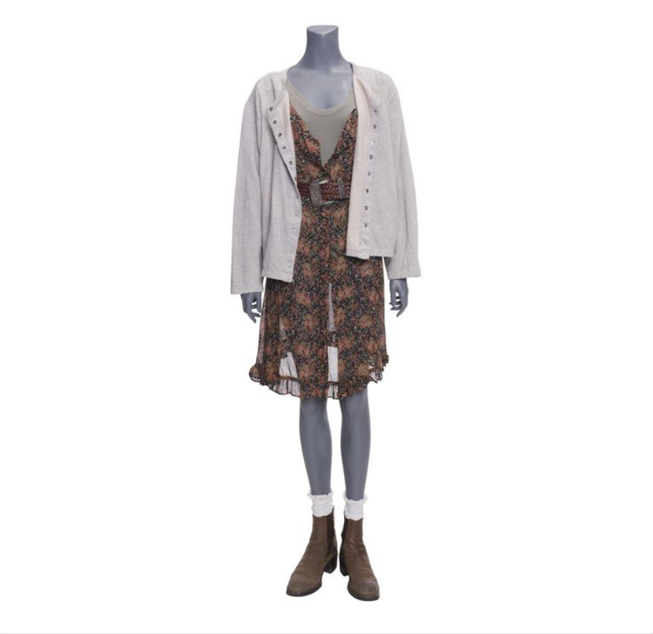grey headless mannequin wears black and pink floral print dress with grey cardigan and brown boots with lace socks