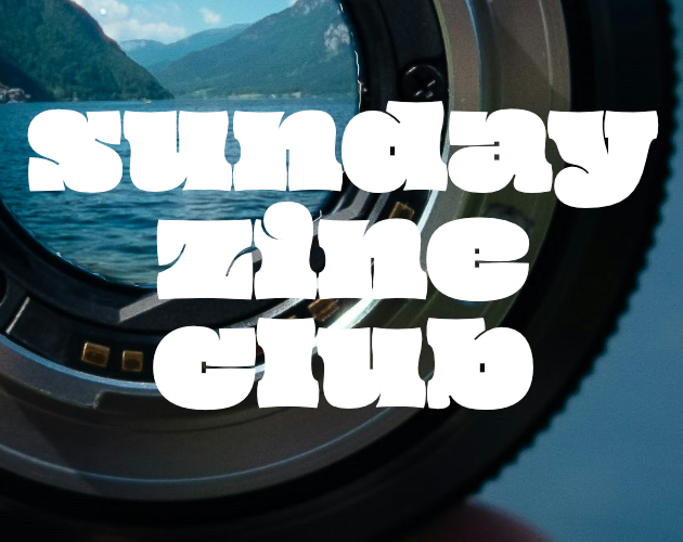 closeup of a lake and mountain landscape as seen through a camera lens. the words on top of the image read sunday zine club